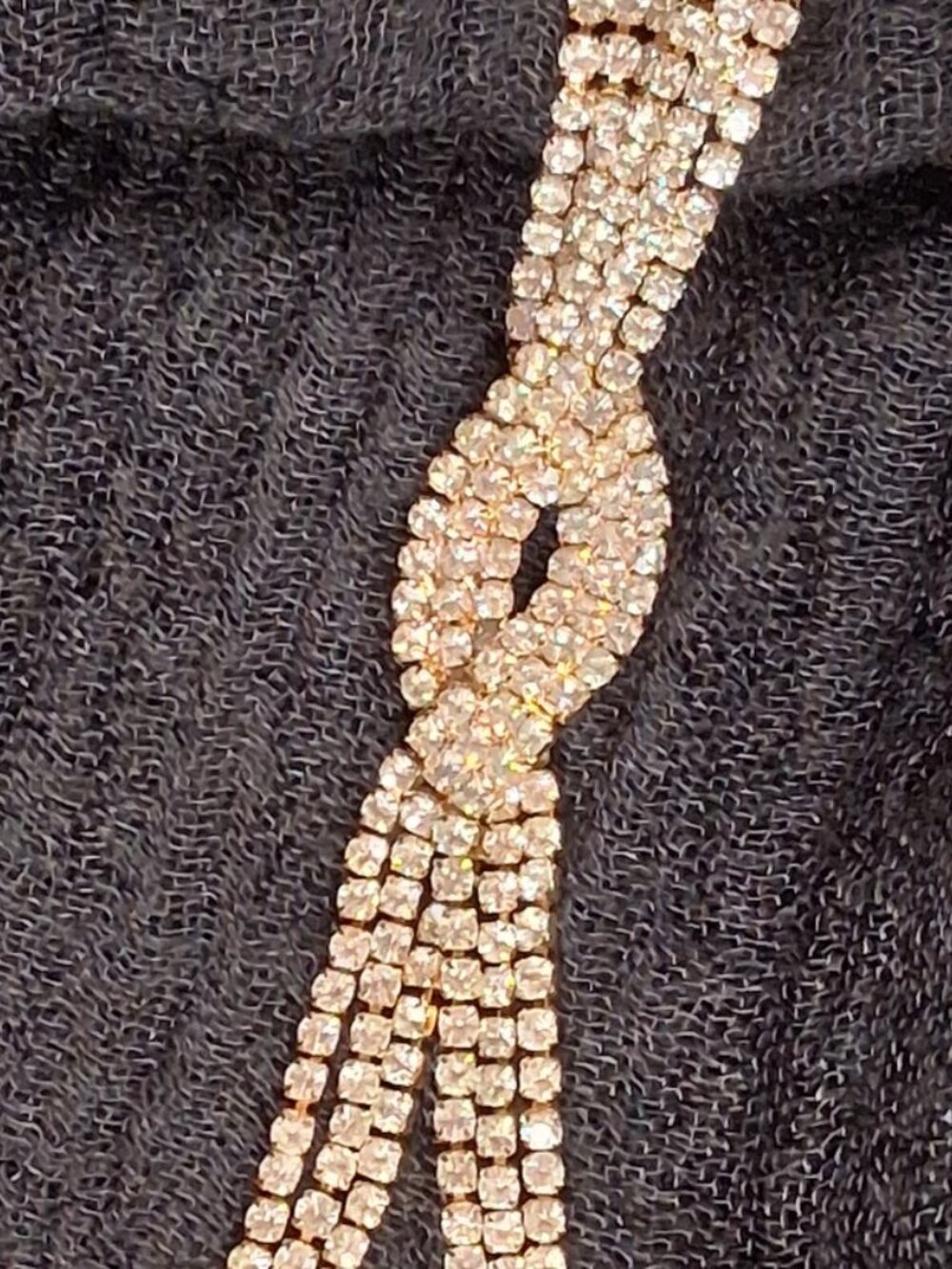 Gold-Tone Rhinestone Tassel Infinity Knot Necklace - Picture 10 of 11
